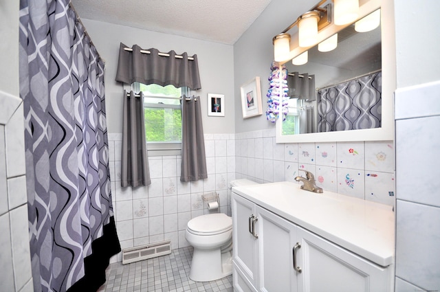 3 Mountain View Dr, Rocky Hill, CT 06067 - bathroom with tile walls, tile patterned floors, vanity, toilet, and a wainscoted wall
