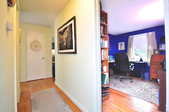 3 Mountain View Dr, Rocky Hill, CT 06067 - hallway featuring wood finished floors, a desk, and baseboards