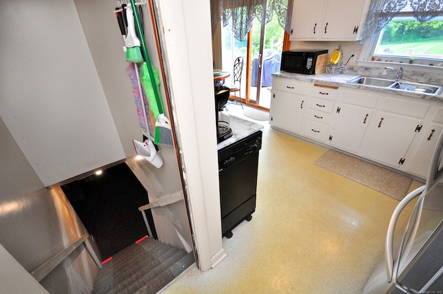 3 Mountain View Dr, Rocky Hill, CT 06067 - kitchen with a sink, black appliances, white cabinets, and light countertops