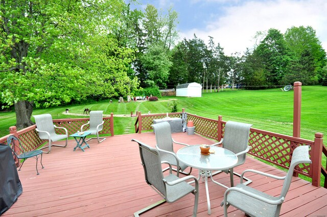 3 Mountain View Dr, Rocky Hill, CT 06067 - wooden terrace with view of scattered trees, outdoor dining space, and a lawn