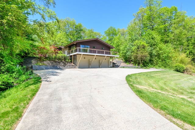 97 W Rd, Marlborough, CT 06447 - view of front facade featuring a garage, driveway, and a wooden deck