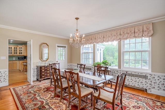 49 Great Ring Rd, Newtown, CT 06482 - dining area featuring ornamental molding, light wood-style flooring, a chandelier, and radiator heating unit