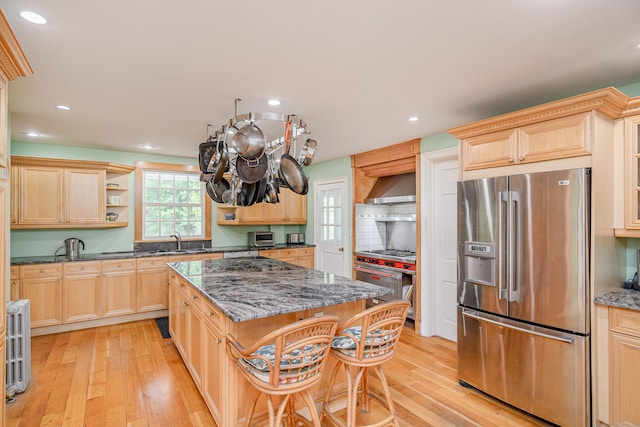49 Great Ring Rd, Newtown, CT 06482 - kitchen with high quality appliances, light brown cabinetry, light wood-style flooring, and recessed lighting