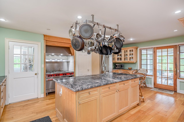 49 Great Ring Rd, Newtown, CT 06482 - kitchen featuring light wood-style flooring, high end stove, tasteful backsplash, wall chimney exhaust hood, and recessed lighting