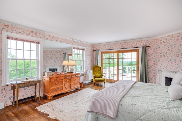49 Great Ring Rd, Newtown, CT 06482 - bedroom featuring wallpapered walls, a fireplace, wood-type flooring, ornamental molding, and access to exterior