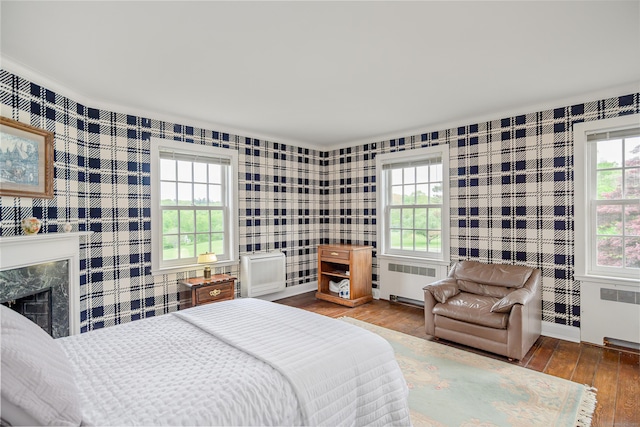 49 Great Ring Rd, Newtown, CT 06482 - bedroom with radiator, wallpapered walls, hardwood / wood-style flooring, and a high end fireplace