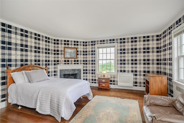 49 Great Ring Rd, Newtown, CT 06482 - bedroom featuring wood finished floors, multiple windows, crown molding, a premium fireplace, and wallpapered walls