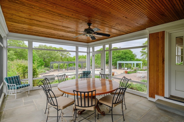 49 Great Ring Rd, Newtown, CT 06482 - sunroom / solarium featuring a ceiling fan, wooden ceiling, stone tile floors, outdoor dining space, and ornamental molding