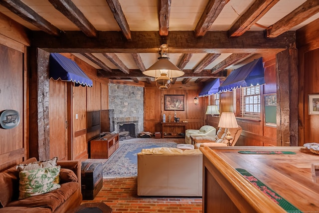 49 Great Ring Rd, Newtown, CT 06482 - living room with wooden walls, brick floors, beamed ceiling, and a stone fireplace