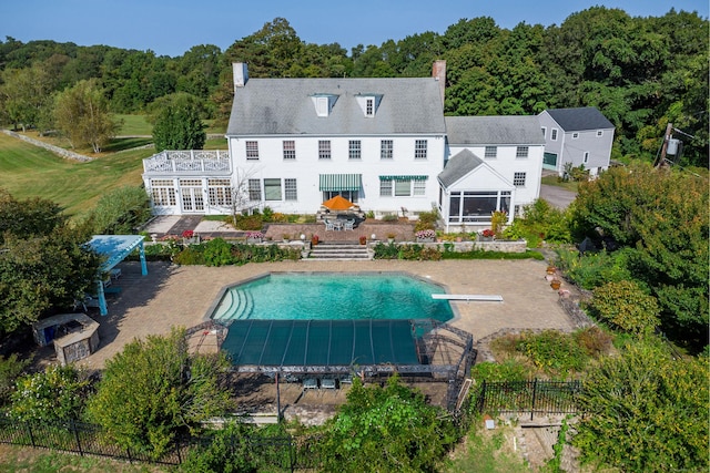 49 Great Ring Rd, Newtown, CT 06482 - back of property with a chimney, a deck, stairs, and a patio area