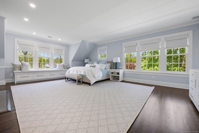 bedroom featuring baseboards, dark wood finished floors, crown molding, and recessed lighting