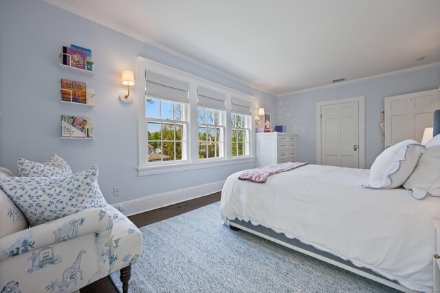 bedroom featuring crown molding, baseboards, and dark wood-style flooring