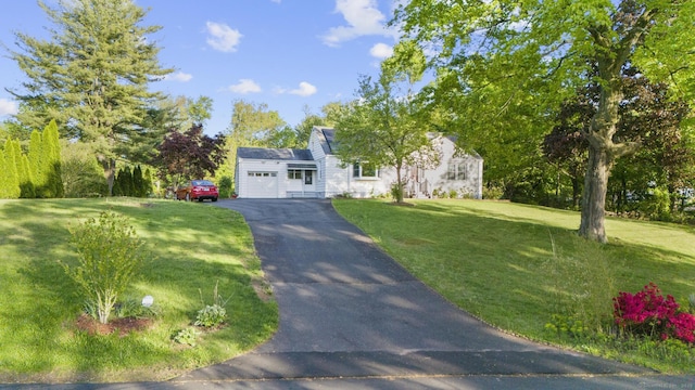 130 Fitch St, North Haven, CT 06473 - view of front of house with driveway, a garage, and a front yard