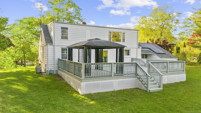130 Fitch St, North Haven, CT 06473 - back of property featuring a gazebo, a yard, a wooden deck, and a chimney