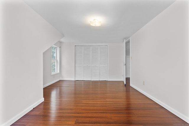 130 Fitch St, North Haven, CT 06473 - unfurnished bedroom featuring wood-type flooring, a closet, and baseboards