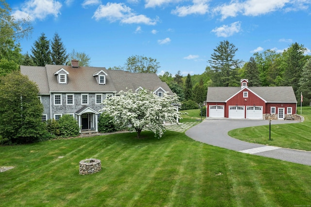 135 Limekiln Rd, Redding, CT 06896 - view of front of home with a front lawn, an outbuilding, a detached garage, driveway, and a chimney