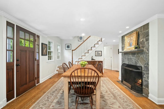 135 Limekiln Rd, Redding, CT 06896 - dining space featuring stairway, a fireplace, light wood-style floors, baseboards, and recessed lighting