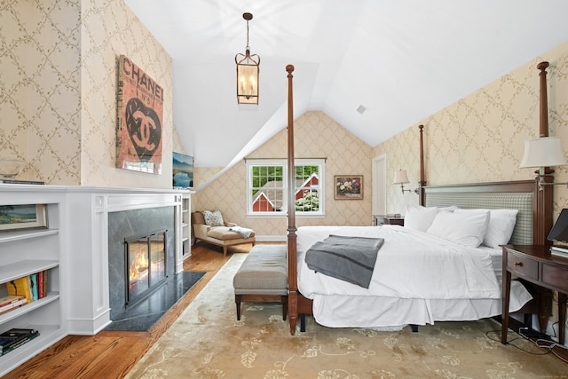 135 Limekiln Rd, Redding, CT 06896 - bedroom featuring wallpapered walls, lofted ceiling, wood finished floors, and a high end fireplace