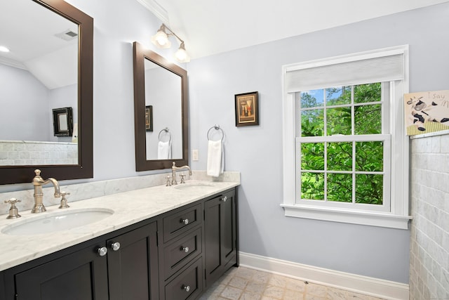 135 Limekiln Rd, Redding, CT 06896 - bathroom featuring baseboards, double vanity, and vaulted ceiling