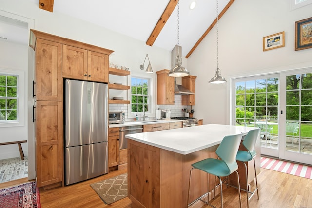 135 Limekiln Rd, Redding, CT 06896 - kitchen with appliances with stainless steel finishes, light wood-style floors, beamed ceiling, backsplash, and open shelves