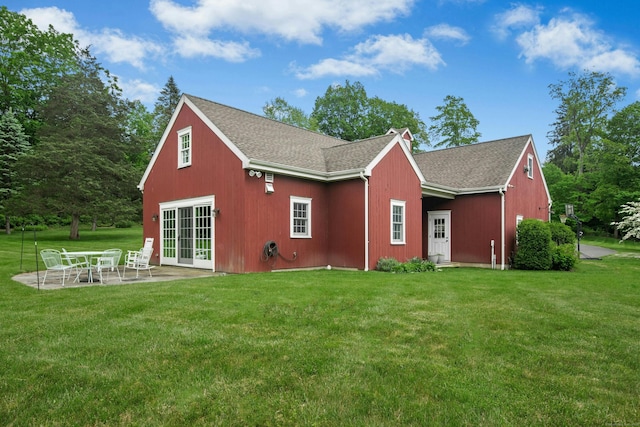 135 Limekiln Rd, Redding, CT 06896 - back of house with a lawn, french doors, a patio area, and roof with shingles
