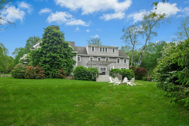 135 Limekiln Rd, Redding, CT 06896 - rear view of property featuring a lawn and a pergola