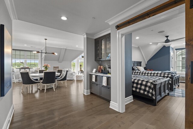 66 High St Unit 40, Guilford, CT 06437 - interior space with open floor plan, dark wood finished floors, glass insert cabinets, lofted ceiling, and a ceiling fan