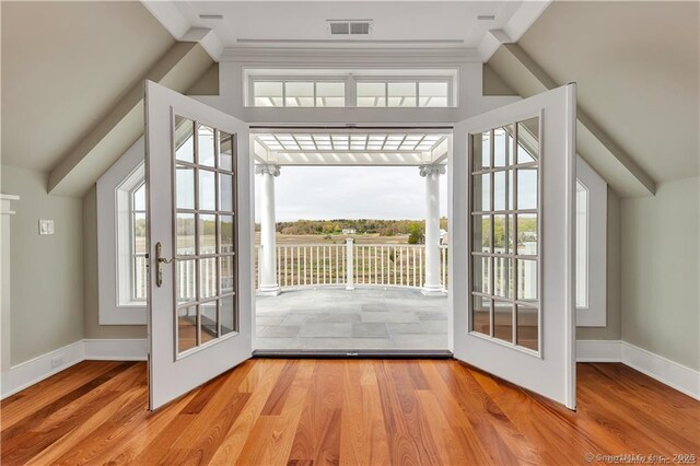66 High St Unit 40, Guilford, CT 06437 - entryway featuring plenty of natural light, wood finished floors, baseboards, and vaulted ceiling