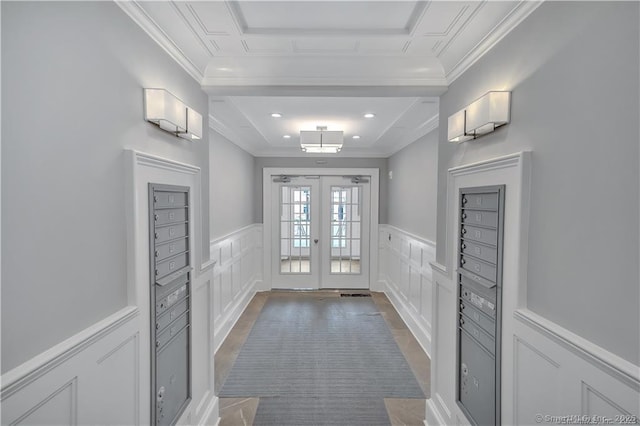 66 High St Unit 40, Guilford, CT 06437 - doorway featuring a decorative wall, crown molding, french doors, a wainscoted wall, and wood finished floors