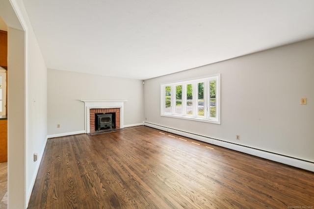 unfurnished living room with a baseboard radiator, wood finished floors, and baseboards