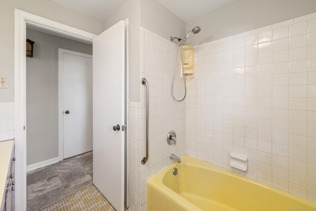 full bath with shower / tub combination, vanity, and tile patterned floors