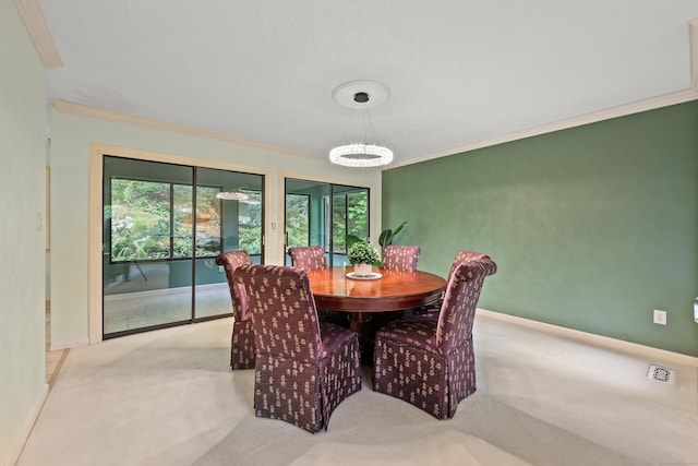 114 Mountain View Rd, Glastonbury, CT 06033 - carpeted dining area with ornamental molding, baseboards, and a chandelier
