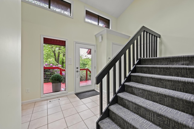 114 Mountain View Rd, Glastonbury, CT 06033 - foyer featuring a high ceiling, tile patterned flooring, stairway, and baseboards