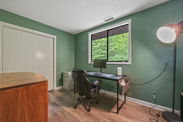 114 Mountain View Rd, Glastonbury, CT 06033 - office featuring wood finished floors, a textured ceiling, and baseboards