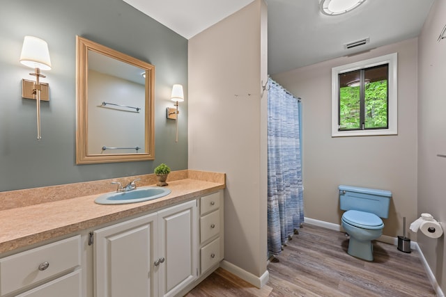 114 Mountain View Rd, Glastonbury, CT 06033 - bathroom featuring toilet, vanity, wood finished floors, baseboards, and a shower with curtain