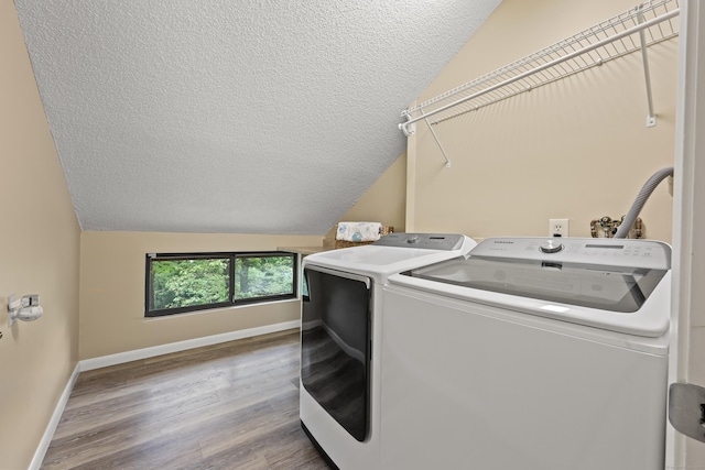 114 Mountain View Rd, Glastonbury, CT 06033 - washroom featuring washing machine and clothes dryer, a textured ceiling, baseboards, and wood finished floors