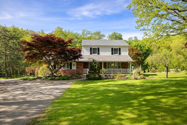 10 Rockwood Ln, Danbury, CT 06811 - view of front of property with covered porch, a front lawn, and driveway