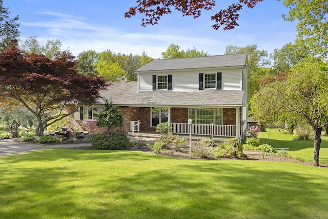 10 Rockwood Ln, Danbury, CT 06811 - traditional home with a porch, a front lawn, and brick siding