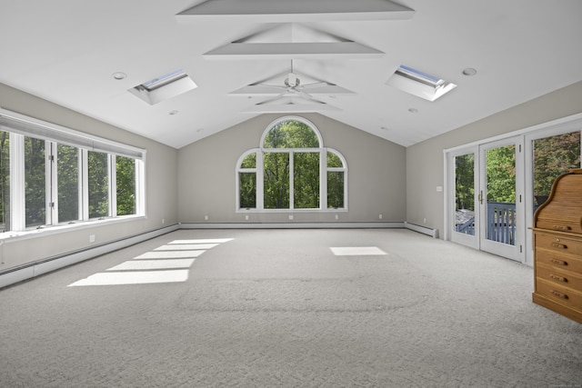 10 Rockwood Ln, Danbury, CT 06811 - carpeted empty room featuring a skylight, ceiling fan, french doors, baseboards, and high vaulted ceiling