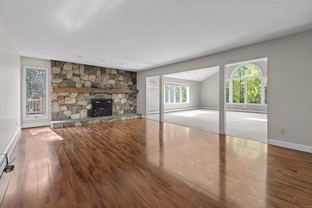 10 Rockwood Ln, Danbury, CT 06811 - unfurnished living room with wood finished floors, baseboards, and a stone fireplace