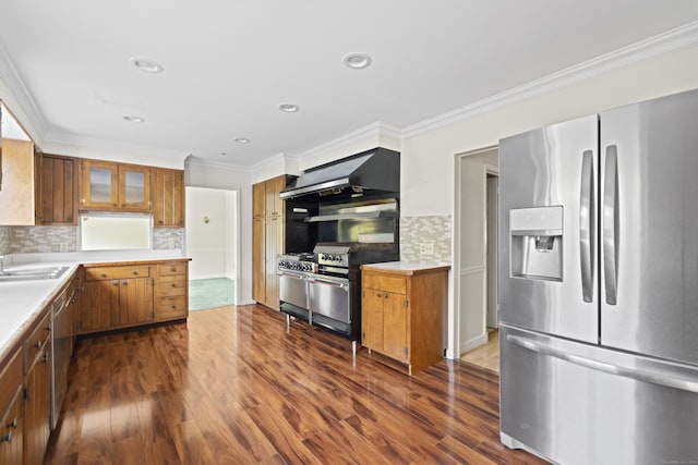 10 Rockwood Ln, Danbury, CT 06811 - kitchen featuring appliances with stainless steel finishes, brown cabinets, ornamental molding, decorative backsplash, and light countertops