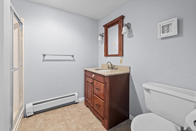 10 Rockwood Ln, Danbury, CT 06811 - bathroom with a baseboard heating unit, vanity, toilet, tile patterned floors, and baseboards