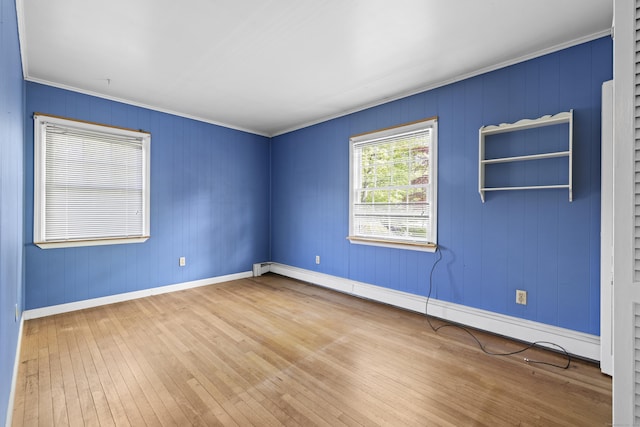 10 Rockwood Ln, Danbury, CT 06811 - unfurnished room with a baseboard heating unit, hardwood / wood-style floors, crown molding, and baseboards