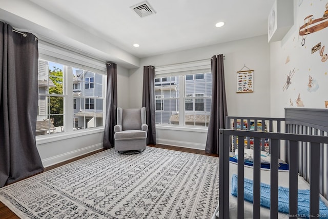 20 3rd St Unit 4, Stamford, CT 06905 - bedroom featuring baseboards, wood finished floors, a crib, and recessed lighting