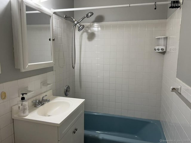 1 Walter Ave Apt 50, Norwalk, CT 06851 - full bath featuring washtub / shower combination, tile walls, and vanity