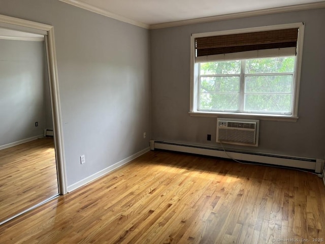 1 Walter Ave Apt 50, Norwalk, CT 06851 - spare room with ornamental molding, baseboard heating, wood finished floors, baseboards, and a wall mounted AC