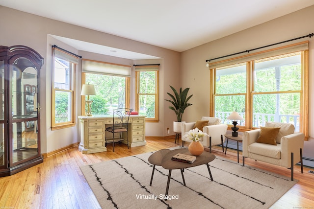 43 Roaring Brook Ln, Shelton, CT 06484 - living room with plenty of natural light, baseboards, baseboard heating, and light wood-style flooring