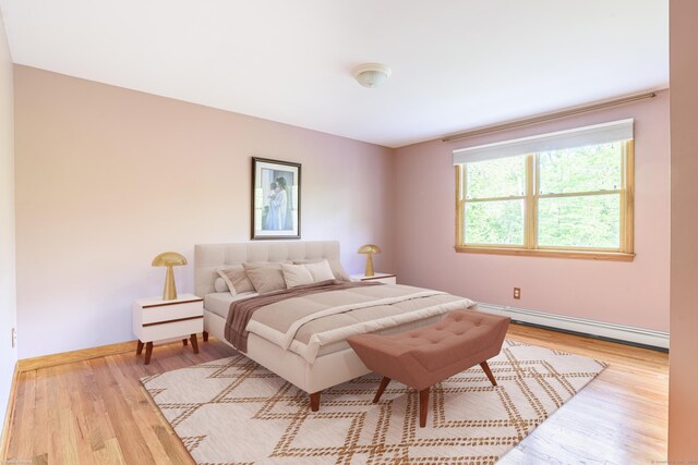 43 Roaring Brook Ln, Shelton, CT 06484 - bedroom with a baseboard heating unit, wood finished floors, and baseboards