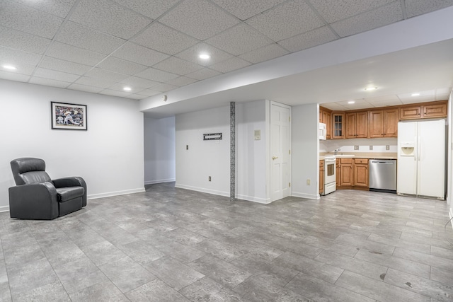 43 Roaring Brook Ln, Shelton, CT 06484 - unfurnished room with recessed lighting, baseboards, a sink, and a paneled ceiling