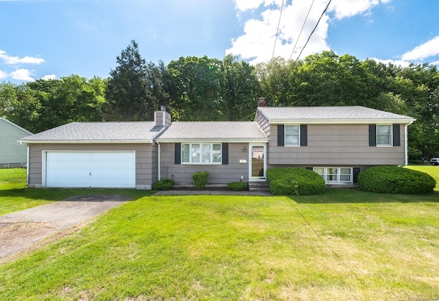 48 Warren St, Cheshire, CT 06410 - tri-level home with asphalt driveway, an attached garage, and a front lawn